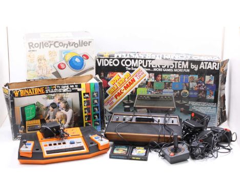 Three boxed vintage electronic games consoles to include the Atari model No. CX-2600 video computer system, a Phillips CD int