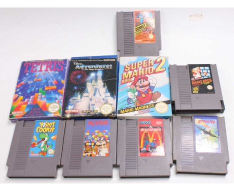 A collection of Nintendo NES boxed and loose video games to include Dr Mario, Super Mario 2, Adventures in the Magic Kingdom,