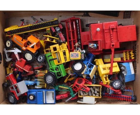 A tray containing a quantity of Britains Tractors and Farming-related models, examples include a Fiat 880DT Tractor, a Massey