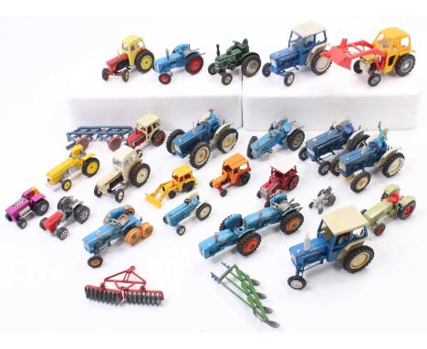 A collection of Britains, Corgi and Dinky model tractors, with specific examples including a Britains Ford 5000 Tractor, a Co