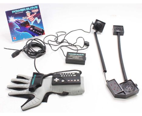 An original Nintendo NES entertainment system power glove, loose example, but appears complete with original instruction leaf