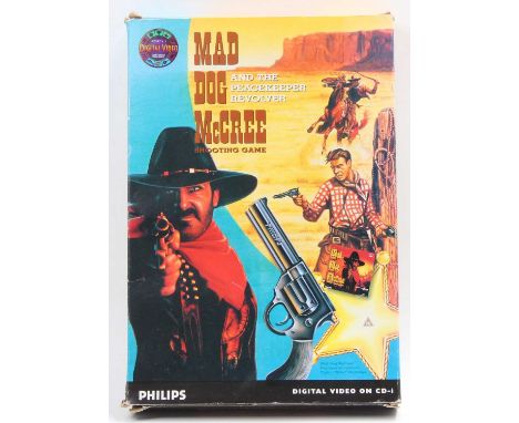 A Phillips digital video on CD-I Mad Dog Mcree shooting game, and The Peace Keeper revolver, housed in the original plastic s