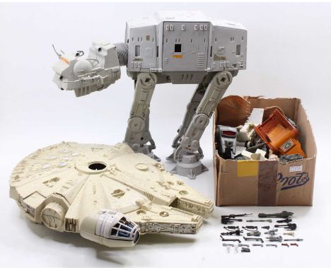 A collection of Kenner Star Wars vehicles including a Millennium Falcon, AT-AT Walker, as well as various miniature vehicles 