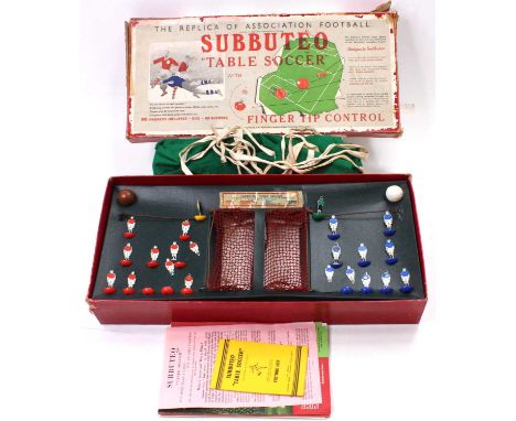 A Subbuteo Table Soccer set from the 1950's comprising 2 teams of 'flats' one in blue, and one in red, 2 goalkeepers on metal