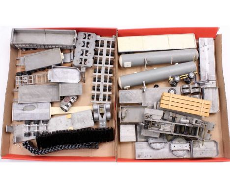 Two trays containing a large collection of various white metal 1/48 and 1/50 scale commercial vehicle trailer kits and access