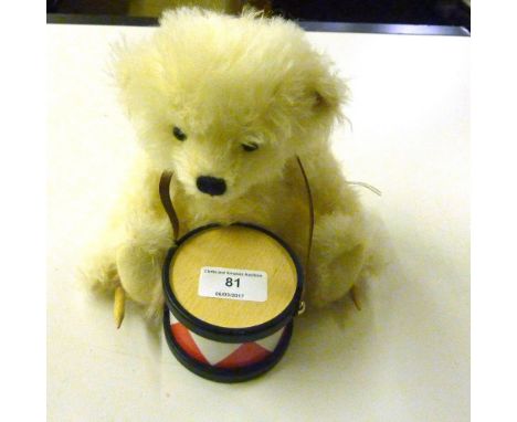 A Steiff bear with a drum