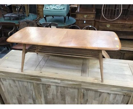 Ercol light elm coffee table with magazine rack undertier