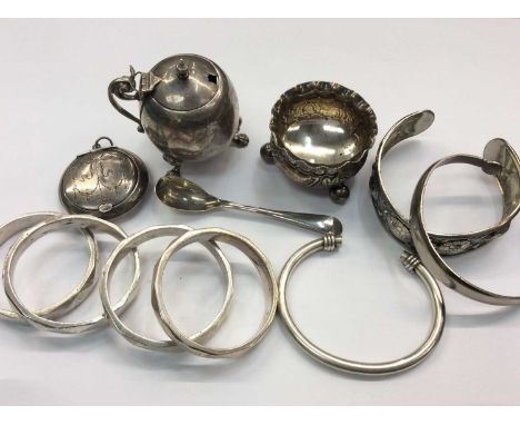Silver mustard pot, silver salt, white metal salt spoon, silver torque bracelet, two other metal bangles, silver compact and 