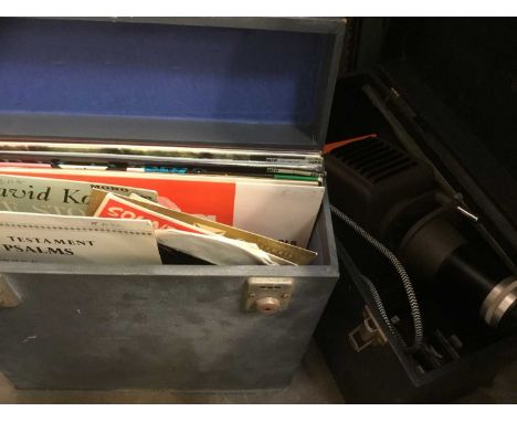 Box of LPs and singles and a cased cine camera