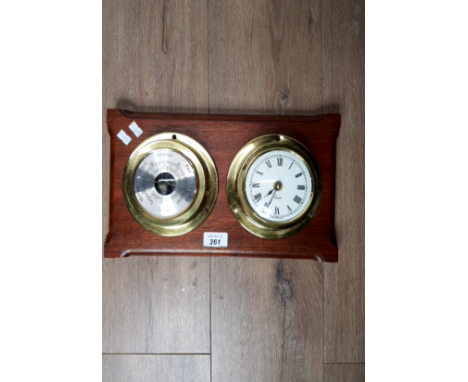 A WALL MOUNTED BRASS BAROMETER AND CLOCK TWO PIECE SET