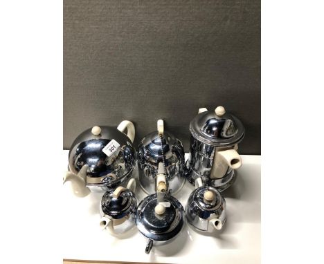 A SHELF OF VINTAGE EVERHOT TEAPOTS ETC