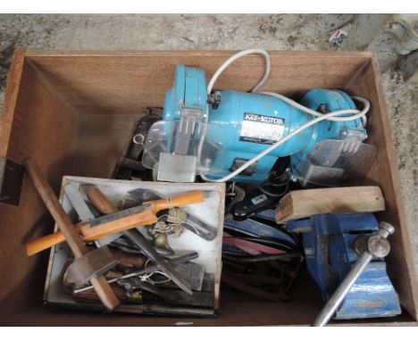 A box of tools including Vice, Sharpening wheel, clamps and various vintage tools 