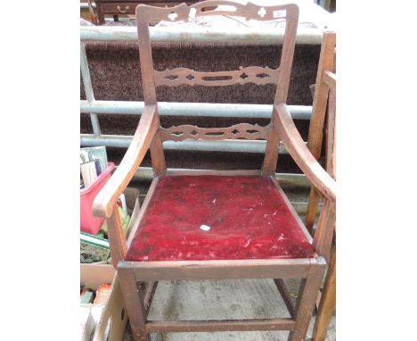 An oak ladder back carver chair 