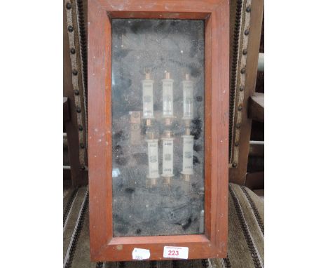 A vintage fuse box with glass front