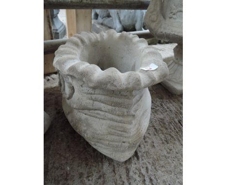 A planter in the shape of a sack