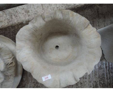 A planter in the shape of a sack