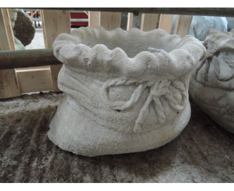 A planter in the shape of a sack