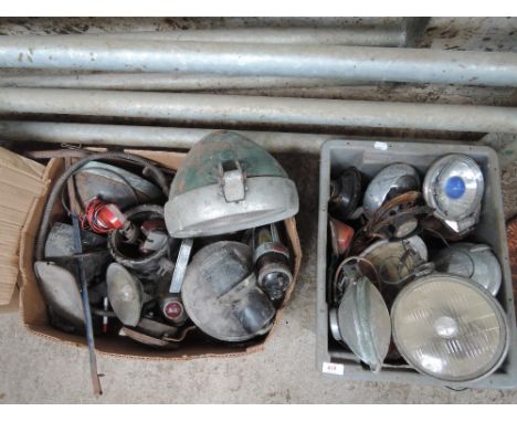 Two boxes of various vintage car and tractor lights etc