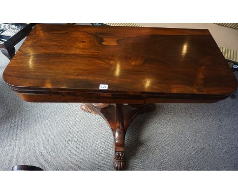 A William IV Rosewood Fold Over Card Table, Having a swivel top enclosing a green felt interior, Raised on ornate tripod supp