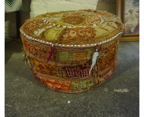 A Middle Eastern Pouffe, 29cm high, 51cm wide 
