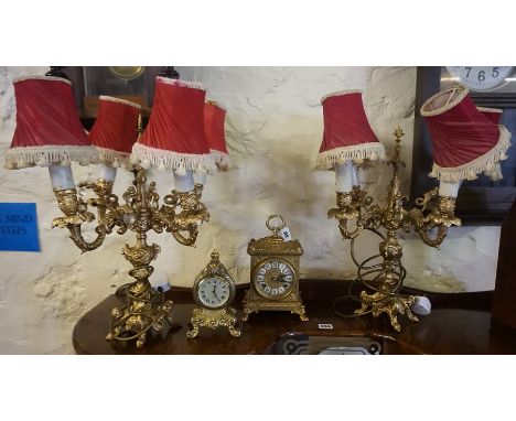 A Pair of Rococo Style Gilt Metal Candleabra, Converted to table lamps, 46cm high, also with a similar mantel clock, and anot