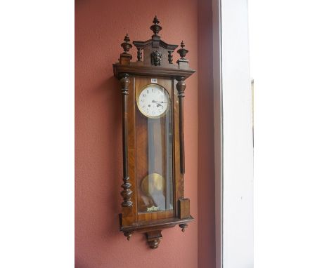 A Walnut Cased Regulator Style Vienna Wall Clock, circa early 20th century, Having a twin train enamel dial, with pendulum an