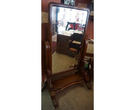 A William IV Mahogany Cheval Mirror, circa early 19th century, Having a swivel mirror, raised on scroll type feet with cerami