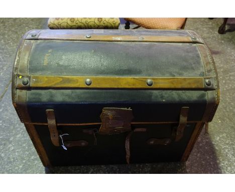 A Victorian Canvas and Leather Covered WIcker Travel Trunk, Having wood splats, 61cm high, 77cm wide