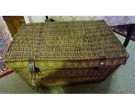 A Large Wicker Laundry Basket, 45cm high, 88cm wide, also with a Victorian tin travel trunk, with original paint work, (2)