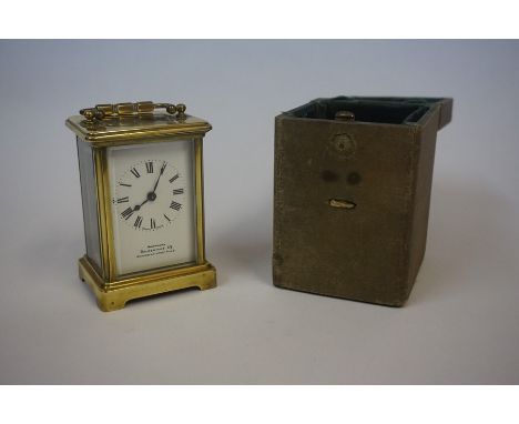 A Brass Carriage Clock, Retailed by Northern Goldsmiths Co, Newcastle upon Tyne, 12cm high, with shagreen mounted box