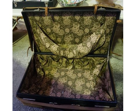 A Vintage Black Leather Bound Travel Case, 59cm wide, having a canvas cover