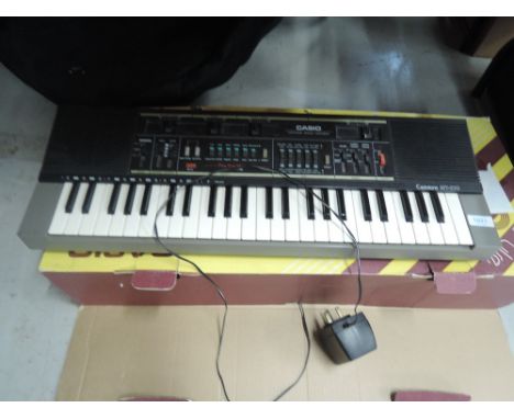 A vintage Casio keyboard, Casiotone MT-210 with original box