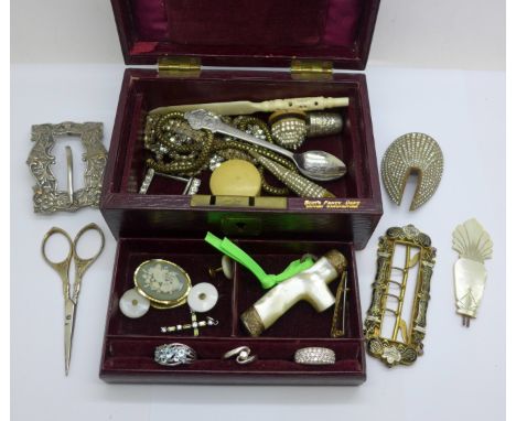 A jewellery box marked 'Boot's Fancy Dept.' with silver rings, a mother of pearl parasol handle, three buckles, one a/f, etc.