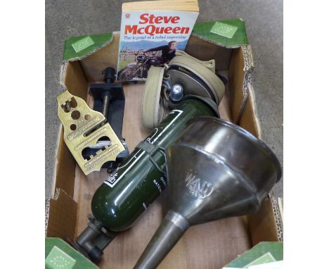 A tank fire extinguisher, military issue funnel, gun kit, button polish, RAF vice, etc. 