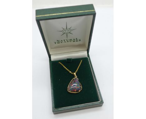 A 9ct gold pendant with large opal doublet on a plated chain 