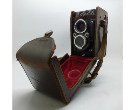 A Microcord camera, 77.5mm, f/3.2, Ross, London, and a light meter 