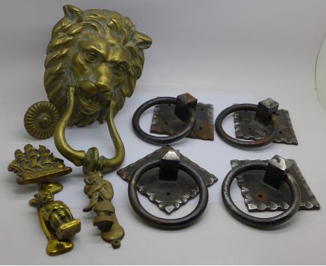 Door furniture and a large brass door knocker in the form of a lion's head 