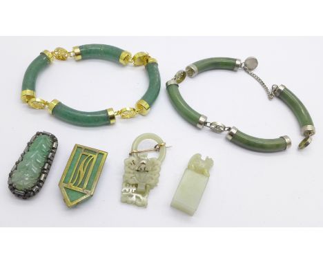 Two jade bracelets, one requires repair, a silver and jade clip marked made in China, one other clip, a brooch and a seal 