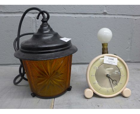 An electric lantern and a Metamec table light **PLEASE NOTE THIS LOT IS NOT ELIGIBLE FOR POSTING AND PACKING** 