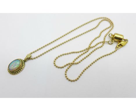 A 9ct gold and opal pendant on a 925 silver gilt chain with magnetic fastener, pendant 1.5g, opal 7mm wide 