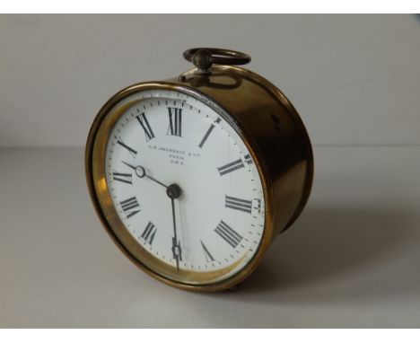 A brass drum cased GWR clock, the white enamel dial marked for J.M. Skarratt &amp; Cie., Paris, numbered 2441 to side, 3.5" d
