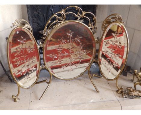 A folding triple mirror panel  brass firescreen, 27" high.  Separate viewing arrangements by appointment.  Drawing Room.