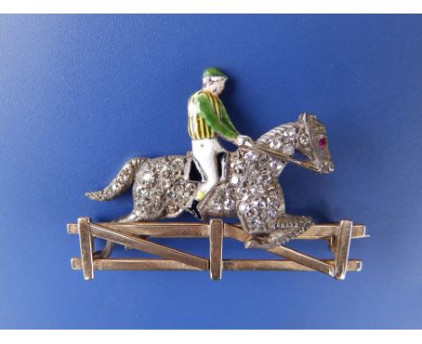 A Victorian diamond set &amp; enamelled gold jockey brooch, the horses body pave set with numerous small diamonds, a ruby eye