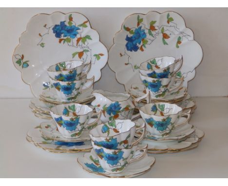 31 pieces of Wileman &amp; Co. Foley 'Japanese Rose' pattern fluted tea china, comprising a pair of 9.5" bread &amp; butter p