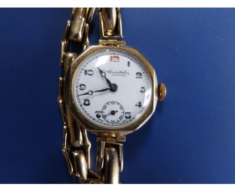 A  lady's 9ct gold patent expanding bracelet wrist watch, the white enamel dial inscribed 'Thos. Russell &amp; Son'.