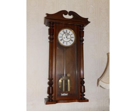 A 19thC Gustav Becker Vienna regulator wall clock, having two piece white enamel dial, large brass pendulum on wooden shaft, 