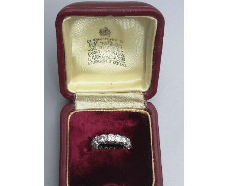 A boxed Garrard &amp; Co. diamond set 18ct white gold eternity ring, claw set with 16 brilliant cut stones having total weigh