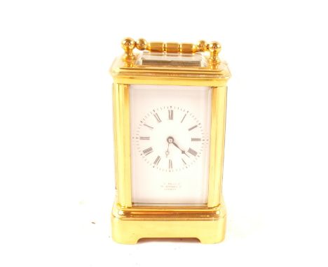 A miniature brass carriage clock, dial marked Pearce, Oxford St