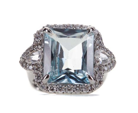 CERTIFICATED AQUAMARINE AND DIAMOND RING,set with a step cut aquamarine of approximately 6.77 carats, flanked by pear shaped 