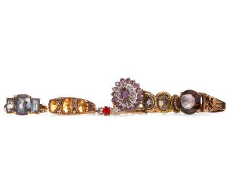 SEVEN GEM SET RINGS,including smoky quartz, amethyst and mystic topaz, five marked for nine carat gold, 14.2g gross, two unma